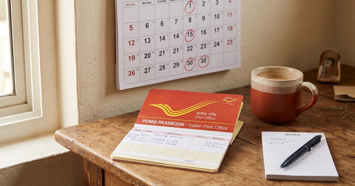 Post Office Monthly Income Scheme passbook beside a calendar marked with monthly interest credit dates, illustrating POMIS